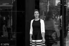Busking - Singing for your supper. Striking black and white in the Auckland fashion area of Queen St, Auckland CBD